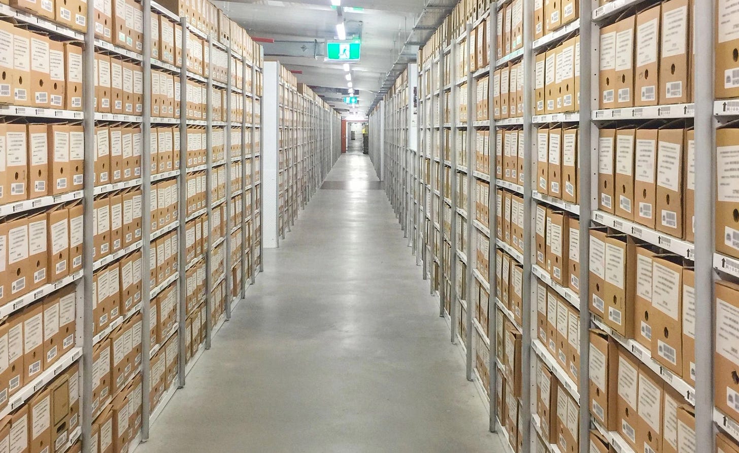 Records storage boxes on rows of shelves