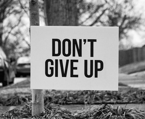 grayscale photo of no smoking sign