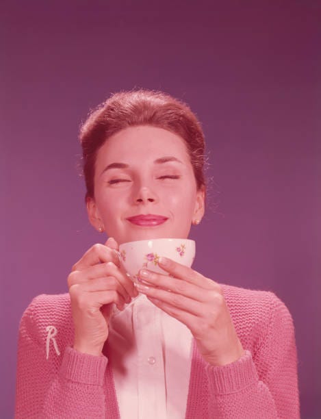 woman drinking hot beverage. (photo by h. armstrong roberts/retrofile/getty images) - 1970s coffee drinker stock pictures, royalty-free photos & images