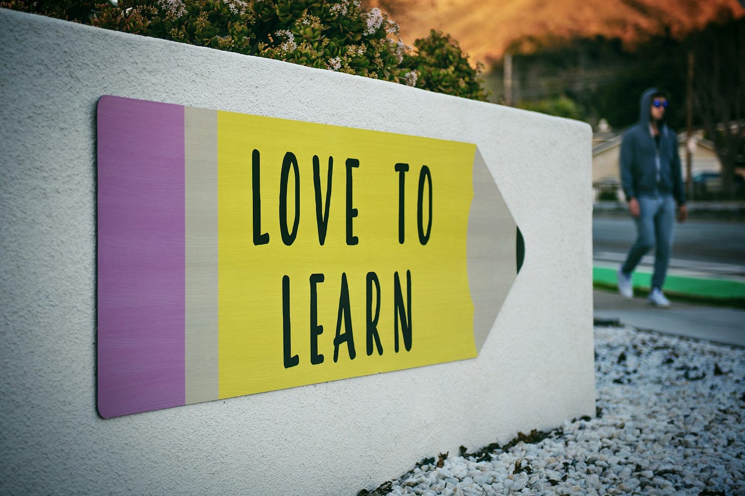 a sign that reads "love to learn" a sign that reads "love to learn"