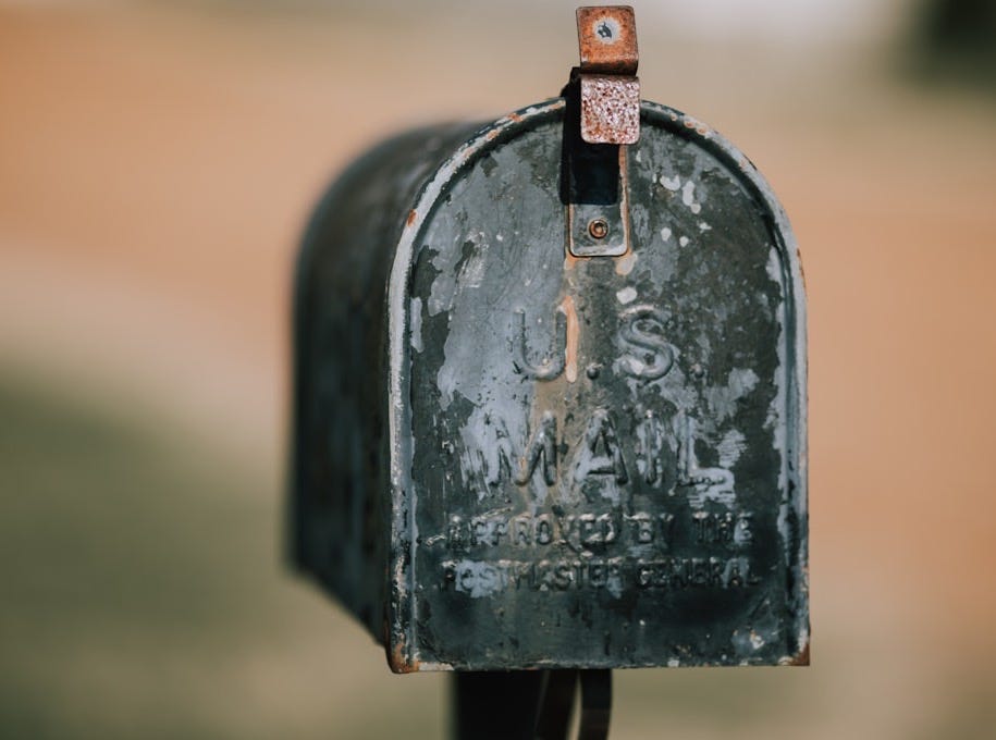 closeup photography of black U.S. mailbox
