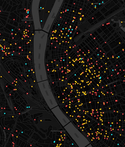 A map of a city with many colored dots

Description automatically generated