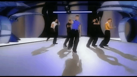 The guys are dancing, and the moves are skip-slapping each of their inner thighs and then turning around backwards and kicking the air