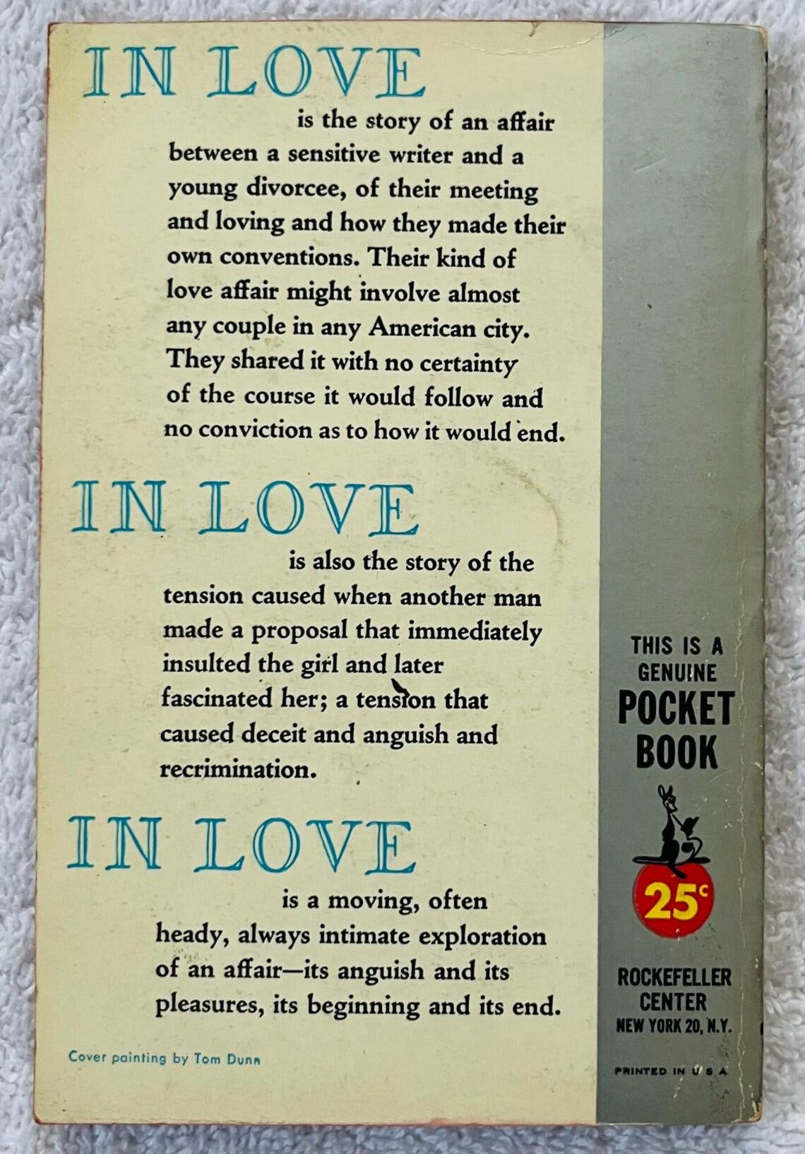 May include: Vintage paperback book cover titled "IN LOVE" with text describing the story of an affair. The cover is light yellow with blue text and includes the text "THIS IS A GENUINE POCKET BOOK". May include: Vintage paperback book cover titled "IN LOVE" with text describing the story of an affair. The cover is light yellow with blue text and includes the text "THIS IS A GENUINE POCKET BOOK".