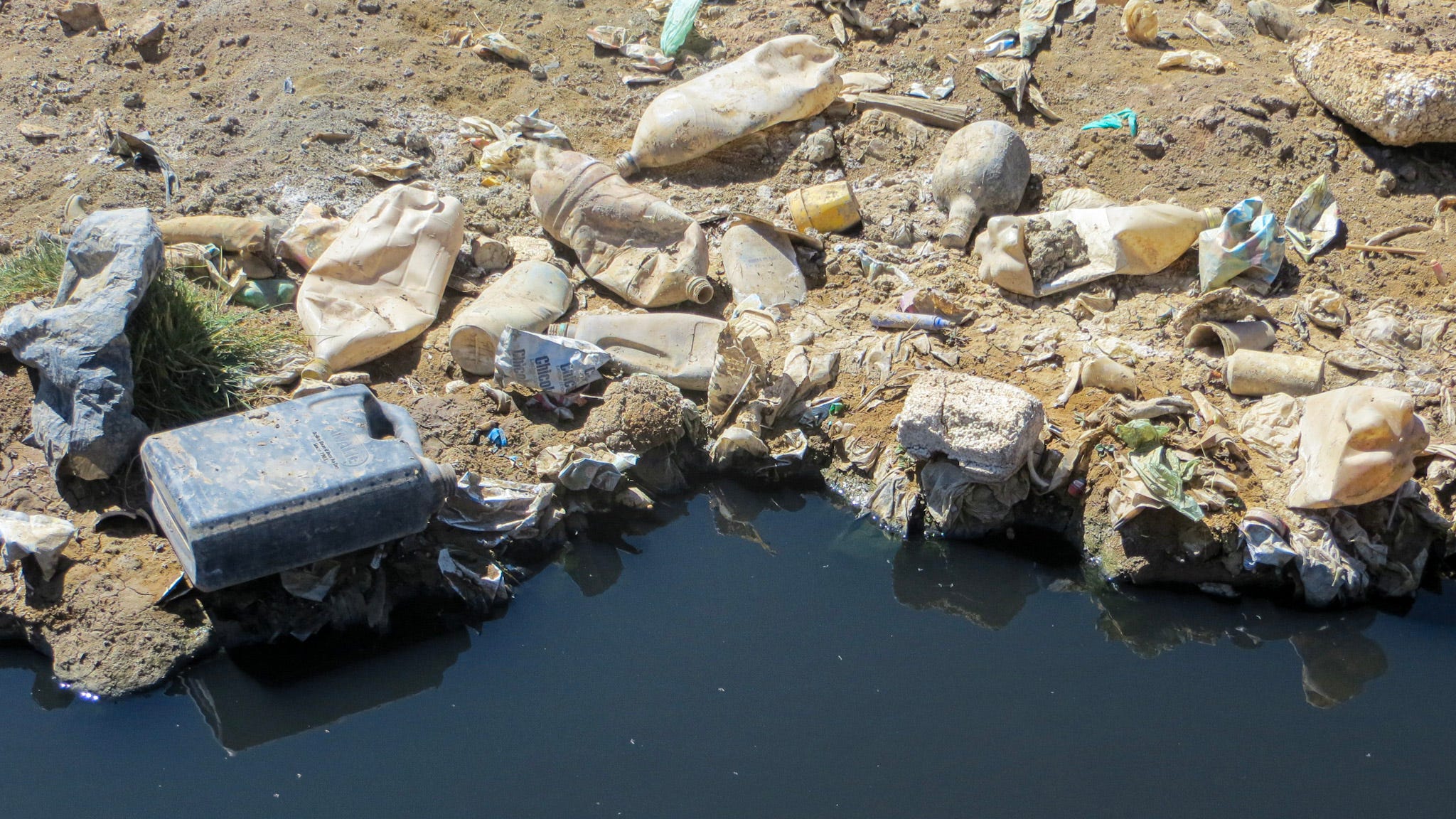 Black water filled with trash