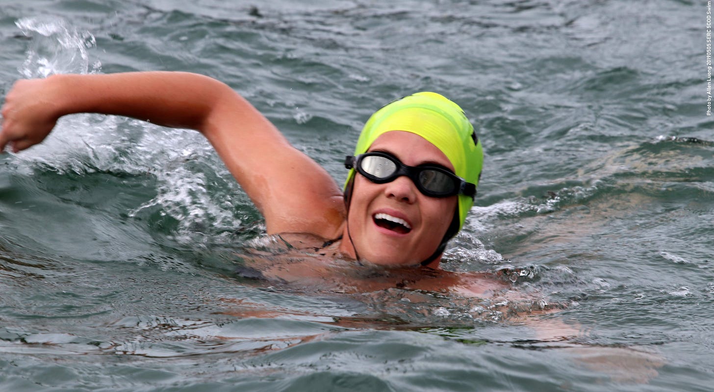 Caroline in a swim cap at Aquatic Park in San Francisco, grinning after a Cinco de Mayo swim race. Caroline in a swim cap at Aquatic Park in San Francisco, grinning after a Cinco de Mayo swim race.