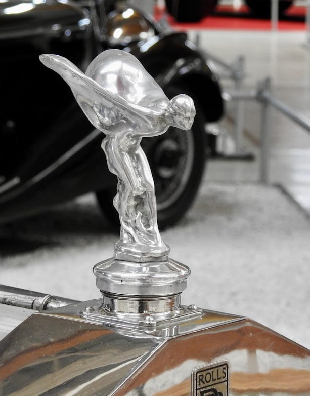 Silver hood ornament on a vintage car