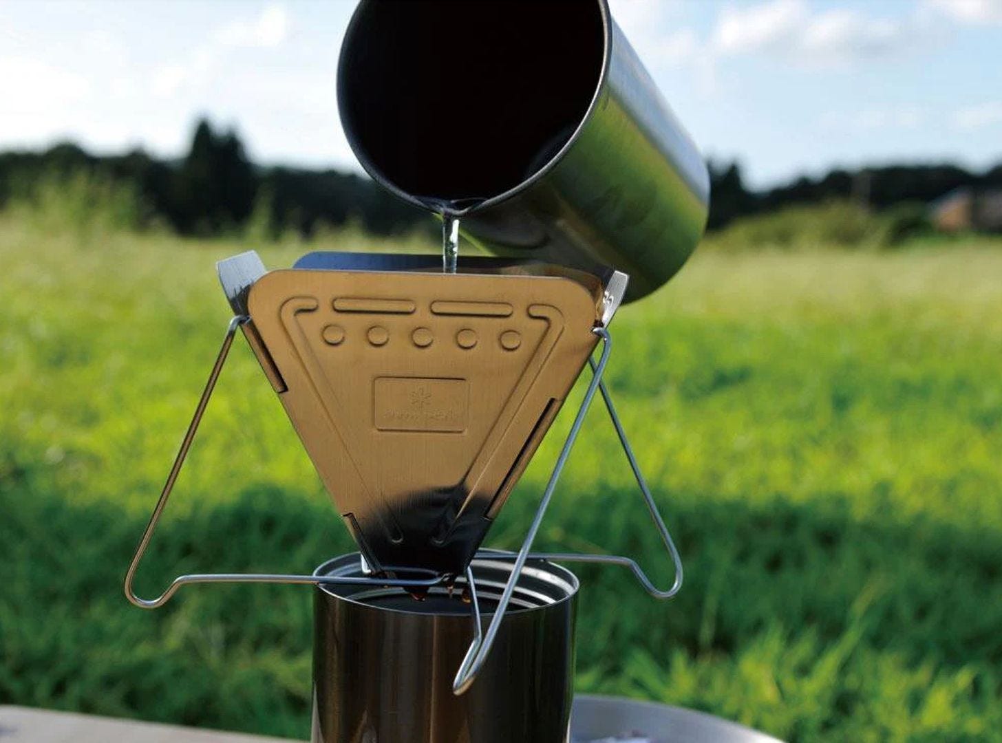 Snow Peak coffee dripper being used at a campsite Snow Peak coffee dripper being used at a campsite