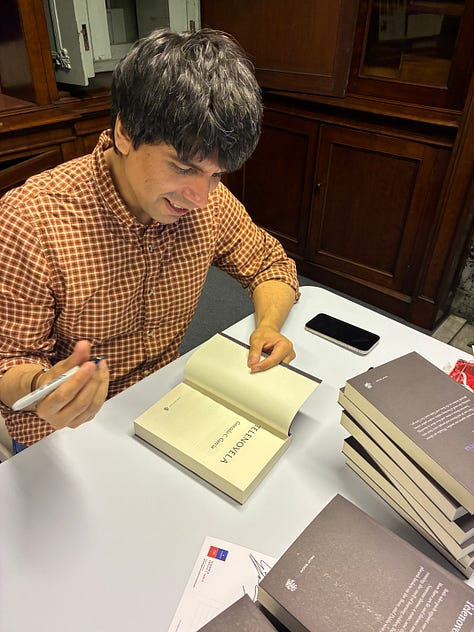 Gonzalo signing books