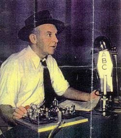 Walter Winchell at microphone