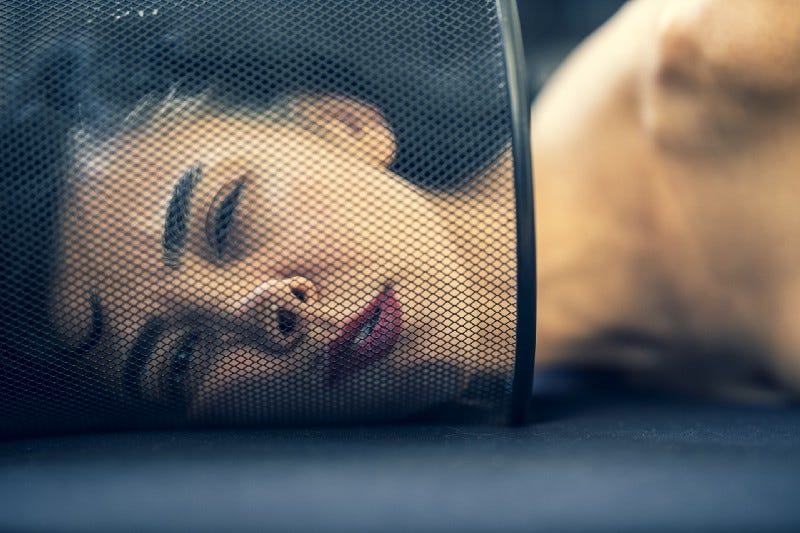 woman’s face squished up against screen