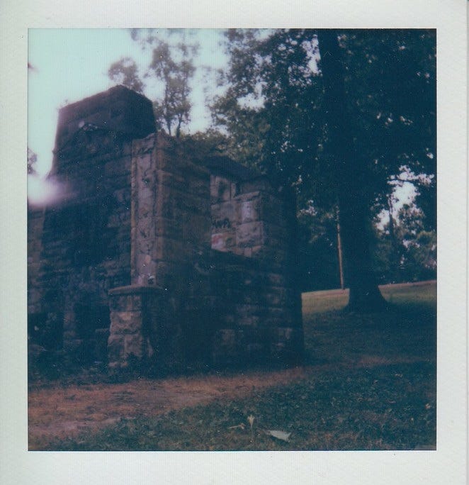 Polaroid of the abandoned stone ranger station at McBride Park.