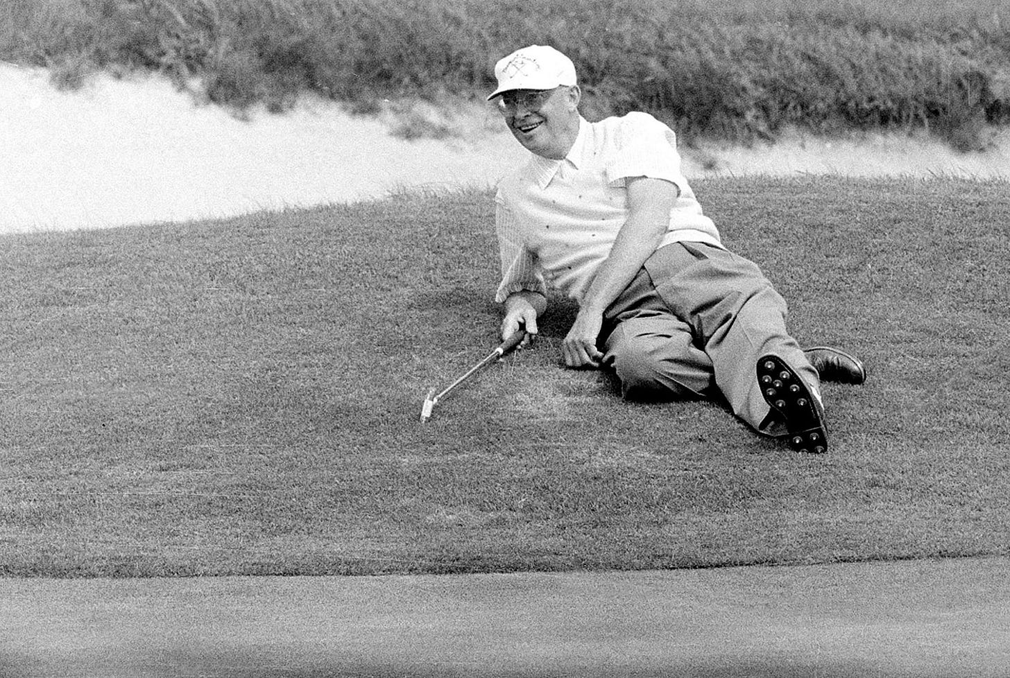 President Franklin D. Roosevelt, wearing a sailor's hat, sails aboard the 45-foot schooner Amberjack from Buzzard's Bay, Mass., toward Campobello Island during his vacation in June 1933.