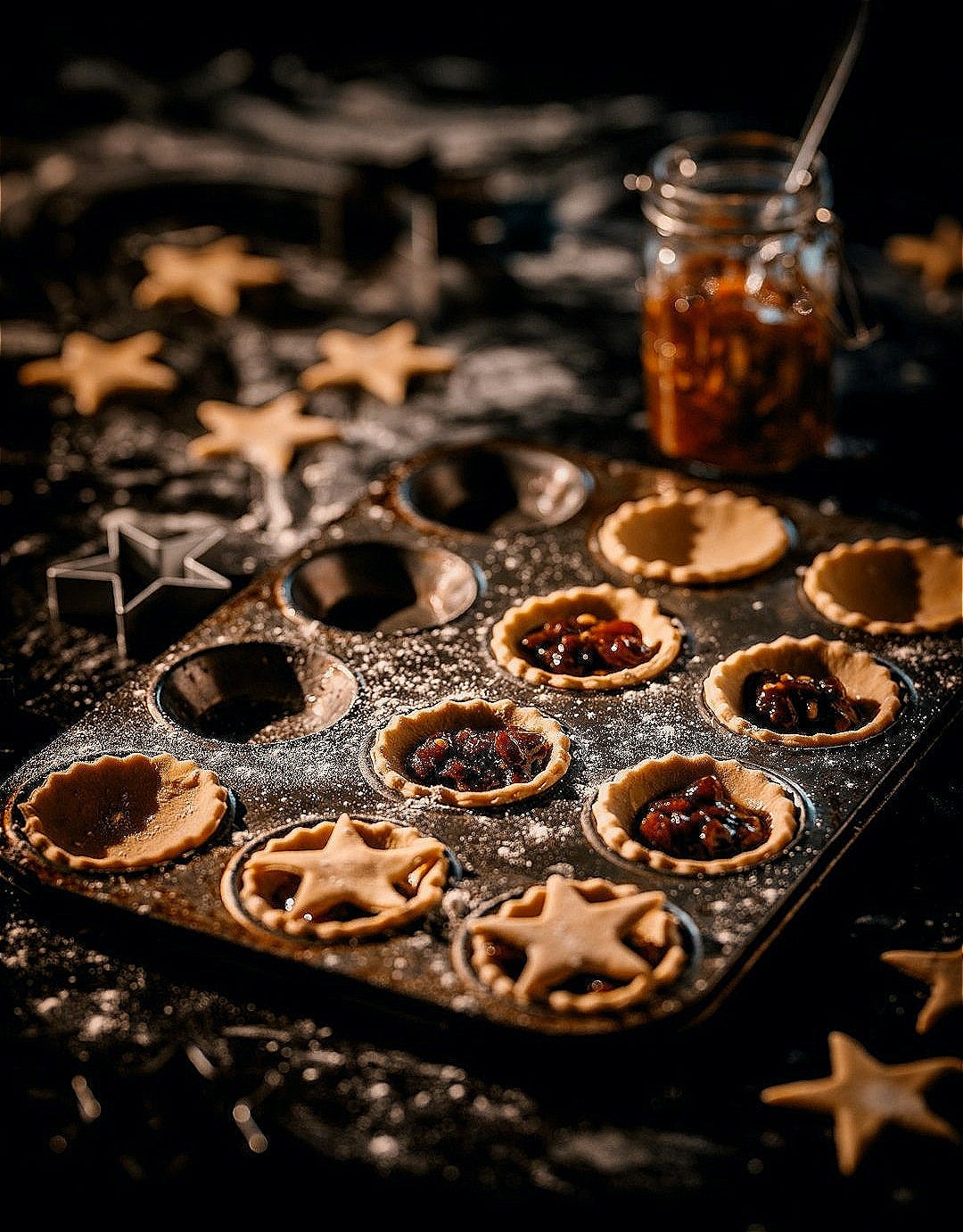 a baking tray filled with mini pies on top of a table