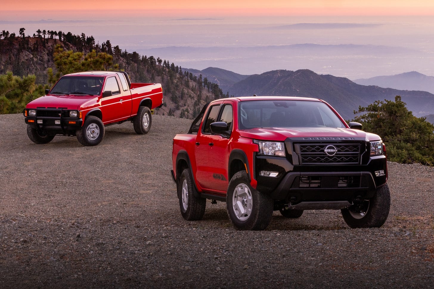 A new 2024 Nissan Frontier Hardbody Edition is parked next to an old 1980s Nissan Hardbody. A new 2024 Nissan Frontier Hardbody Edition is parked next to an old 1980s Nissan Hardbody.