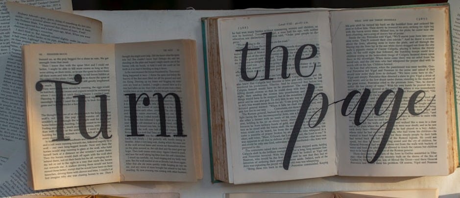 books on white wooden table