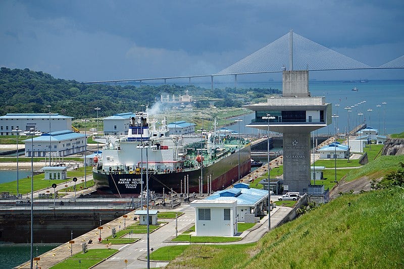 A ship in a lock

Description automatically generated