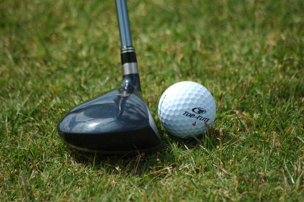 Golf Club Against Ball
