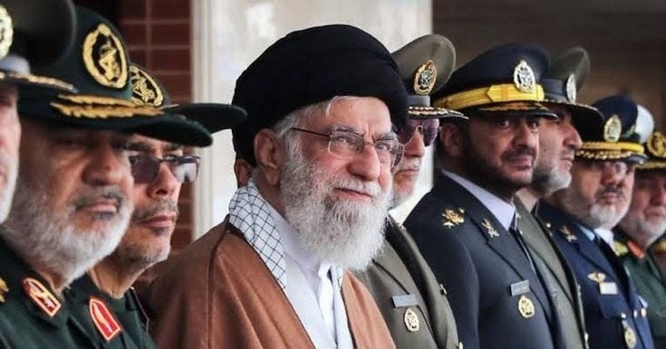 This may contain: an old man standing in front of microphones with other men wearing uniform behind him This may contain: an old man standing in front of microphones with other men wearing uniform behind him