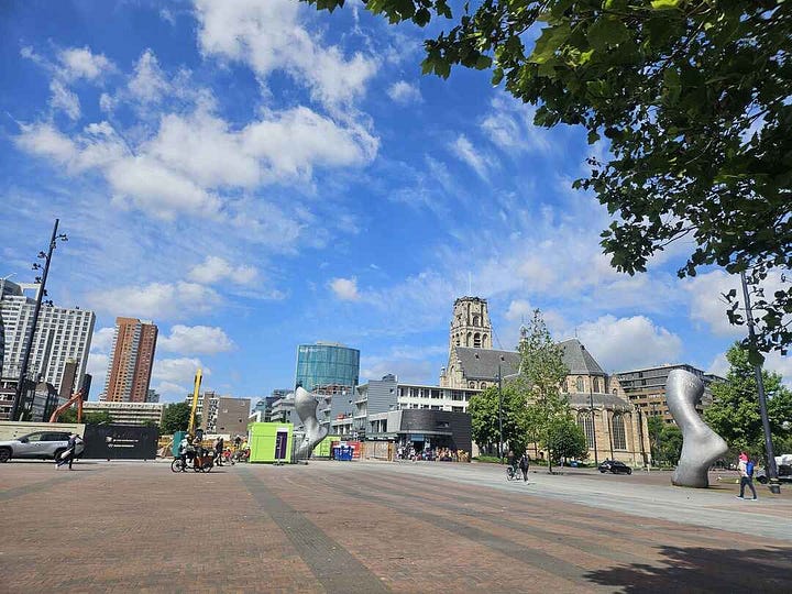Rotterdam central squares with paving stone walking areas and several modern art sculptures