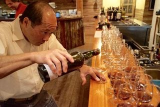 Eric Ifune pours Eric Ifune pours