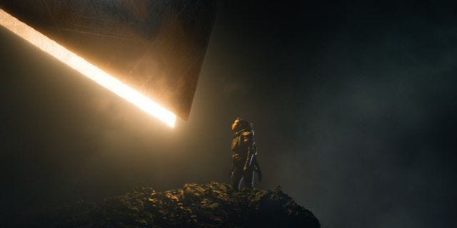 Screencap from Foundation, in which one of new characters, a young black woman on Terminus, is faced with a mysterious high tech object. Screencap from Foundation, in which one of new characters, a young black woman on Terminus, is faced with a mysterious high tech object.