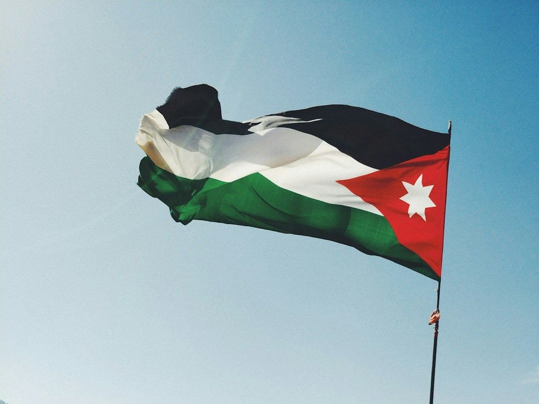 Jordan flag on rock formation Jordan flag on rock formation