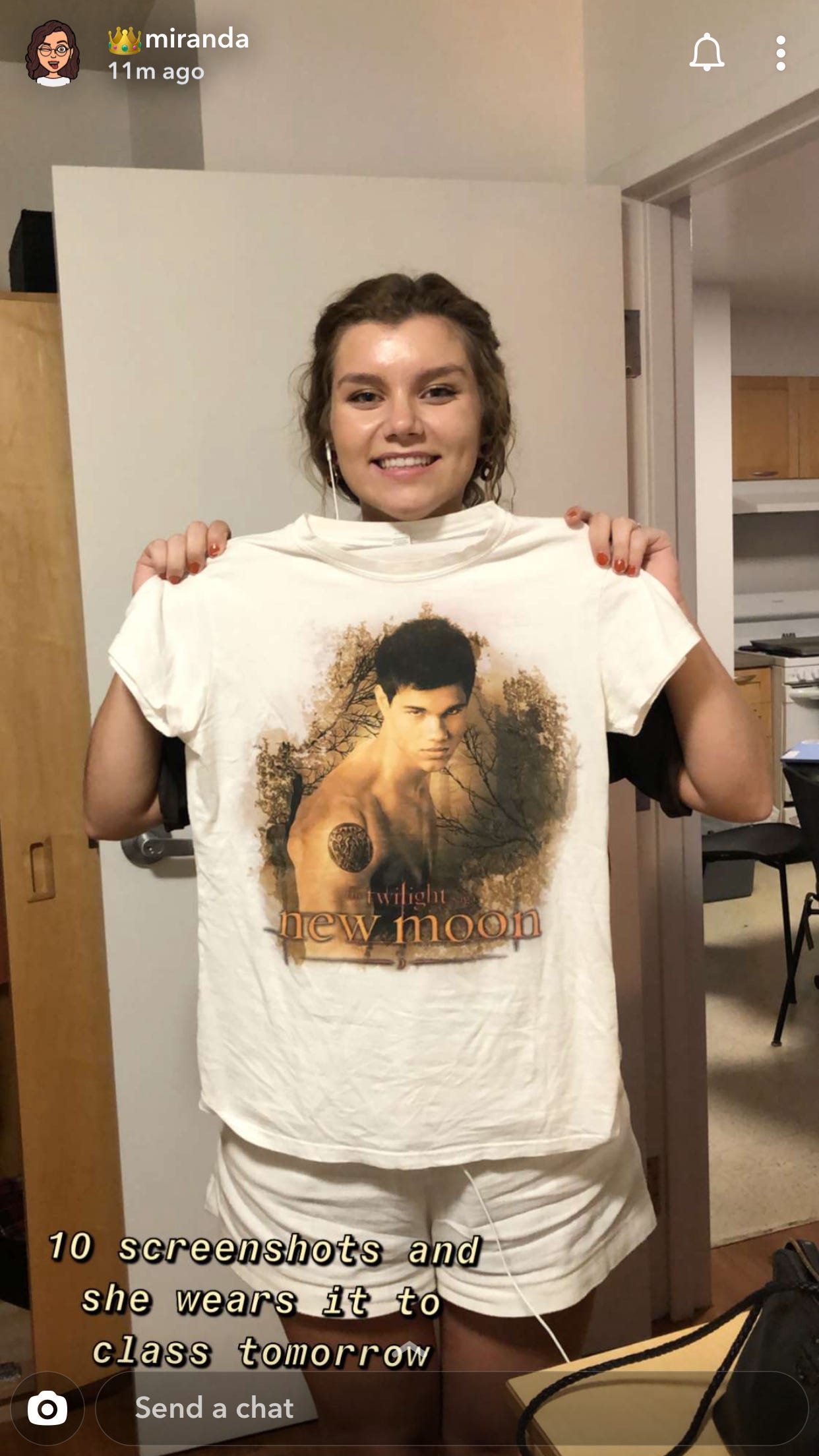 A Snapchat screenshot of Abe holding a Jacob Black t-shirt with the caption "10 screenshots and she wears it to class tomorrow"
