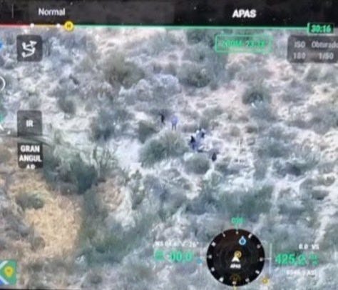 Mexican cartel drone operator view of migrants being guided on US side of the Rio Grande as he watches for Border Patrol activity nearby. Mexican cartel drone operator view of migrants being guided on US side of the Rio Grande as he watches for Border Patrol activity nearby.