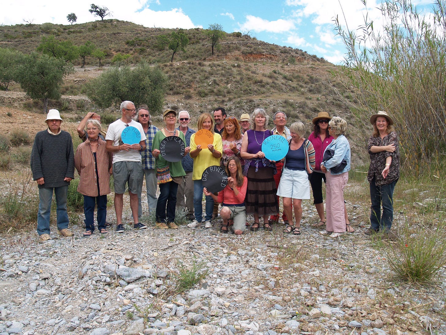 An awareness event in Almeria, Spain, where people gathered at a dry riverbed to illustrate how low rainfall and heatwaves lead to desertification. An awareness event in Almeria, Spain, where people gathered at a dry riverbed to illustrate how low rainfall and heatwaves lead to desertification.