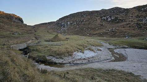 Iron age house at Bosta, and bell