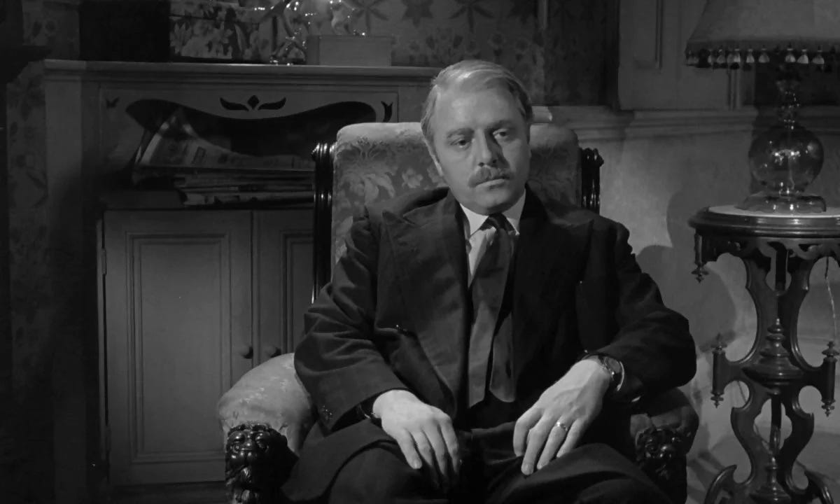 Richard Attenborough sitting in an armchair looking folorn Richard Attenborough sitting in an armchair looking folorn