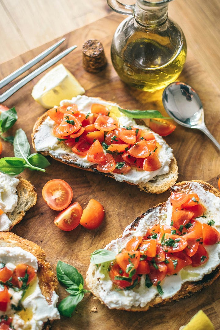 Pasta on a fork. Olive oil with tomato bread. Photos by Alice Pasqual and Calum Lewis via Unsplash.