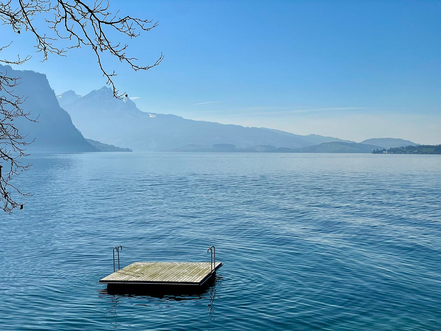 Swimming raft on Lake Luzern/Vierwaldstättersee with mountains in background
