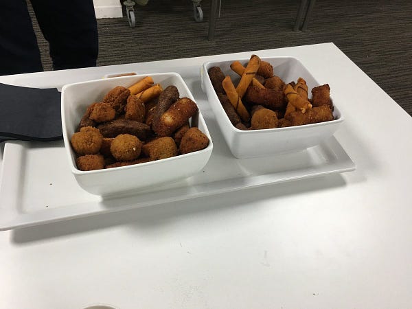 One of these was meat. Another was bread. Another had cheese in them. There were dipping sauces. All were good.