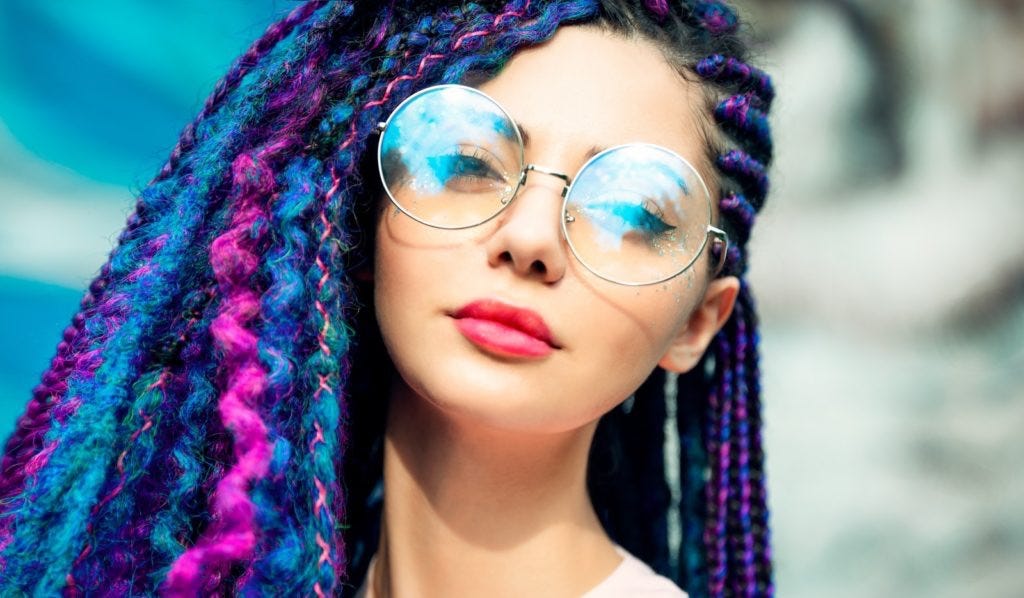 woman wearing silver framed aviator style sunglasses woman wearing silver framed aviator style sunglasses