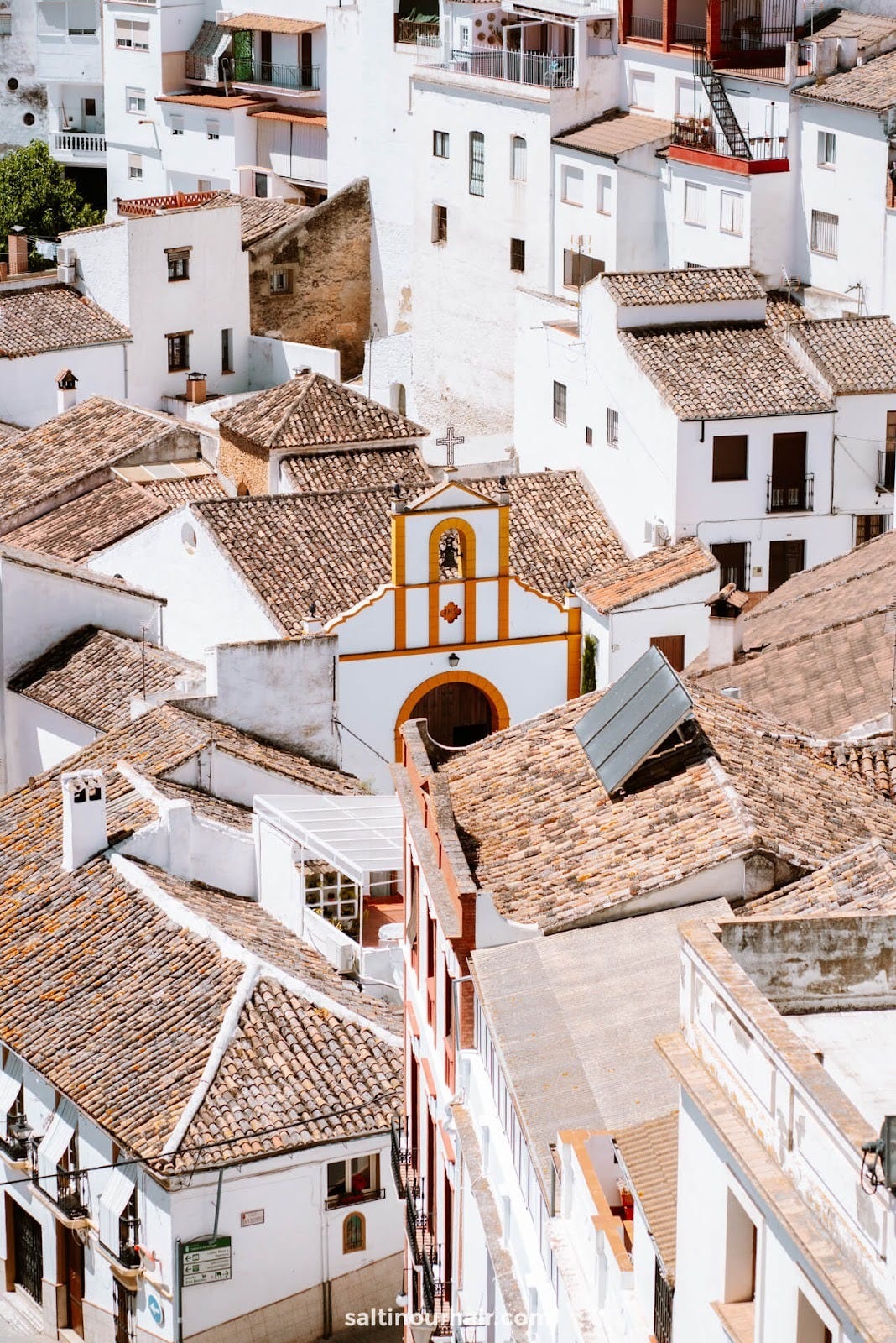 White Stucco buildings clustered together for shade in Setenil de las Bodegas, Spain. Source