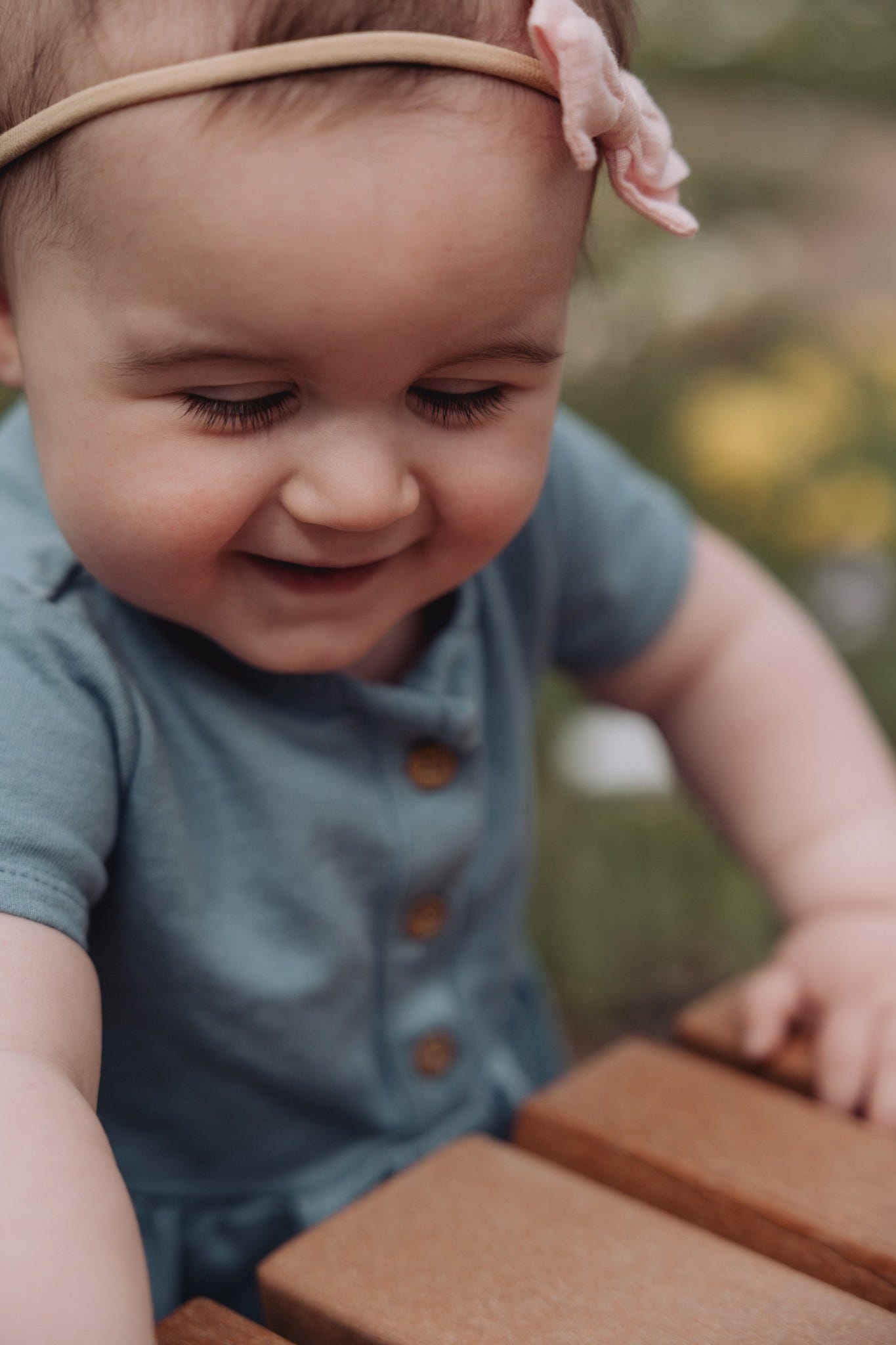 May be an image of 1 person, baby, smiling and flower