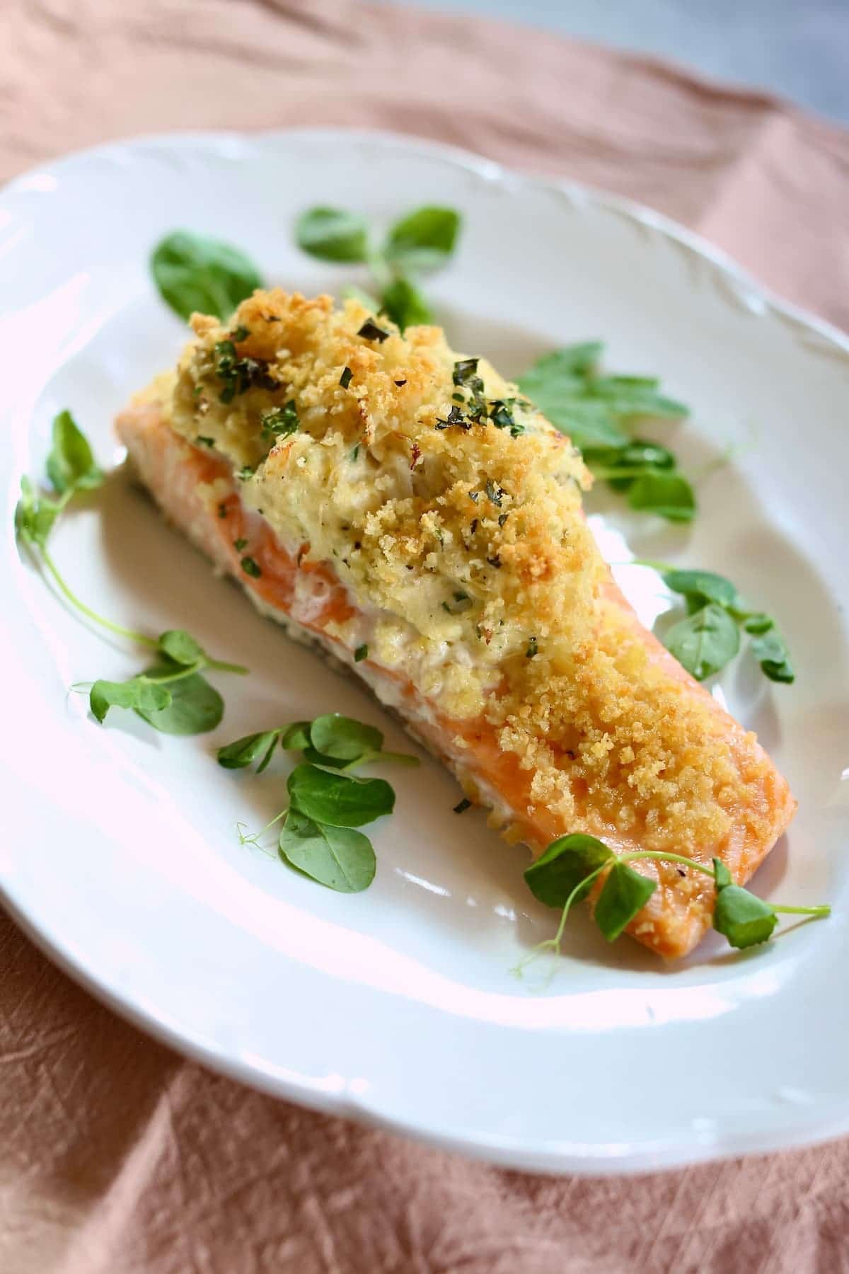 a white plate of stuffed salmon 