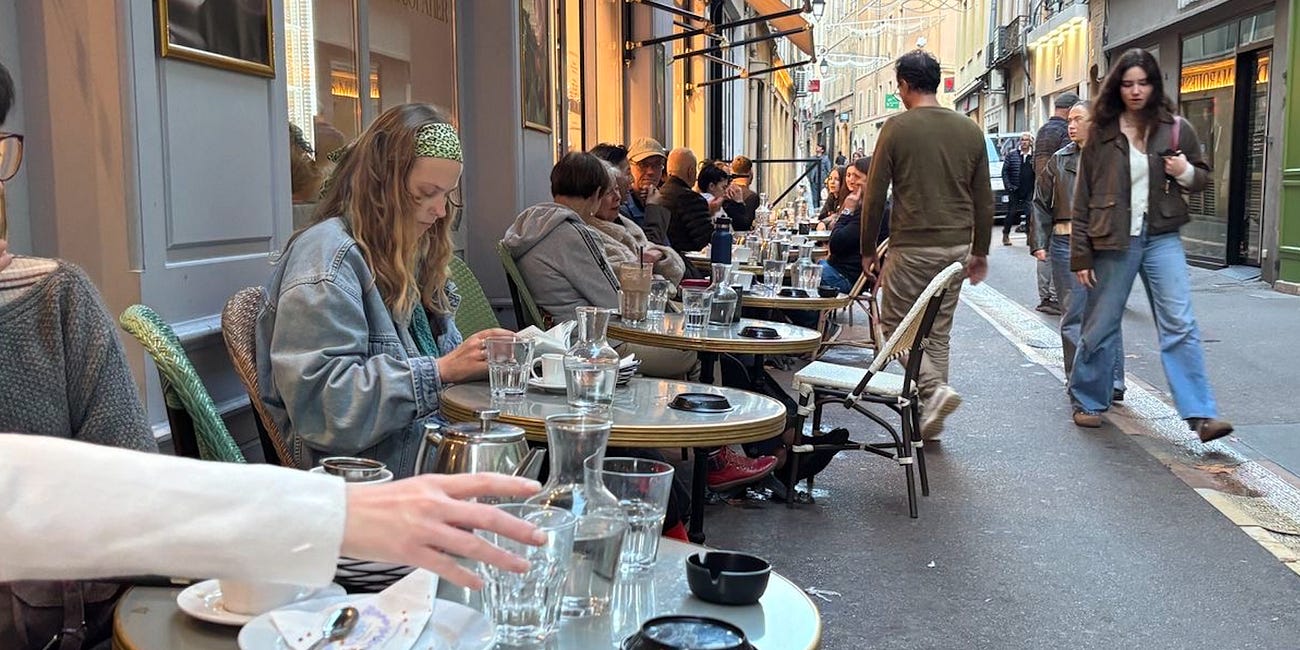 I sat outside a café in Paris for two hours. Here's everything I saw.