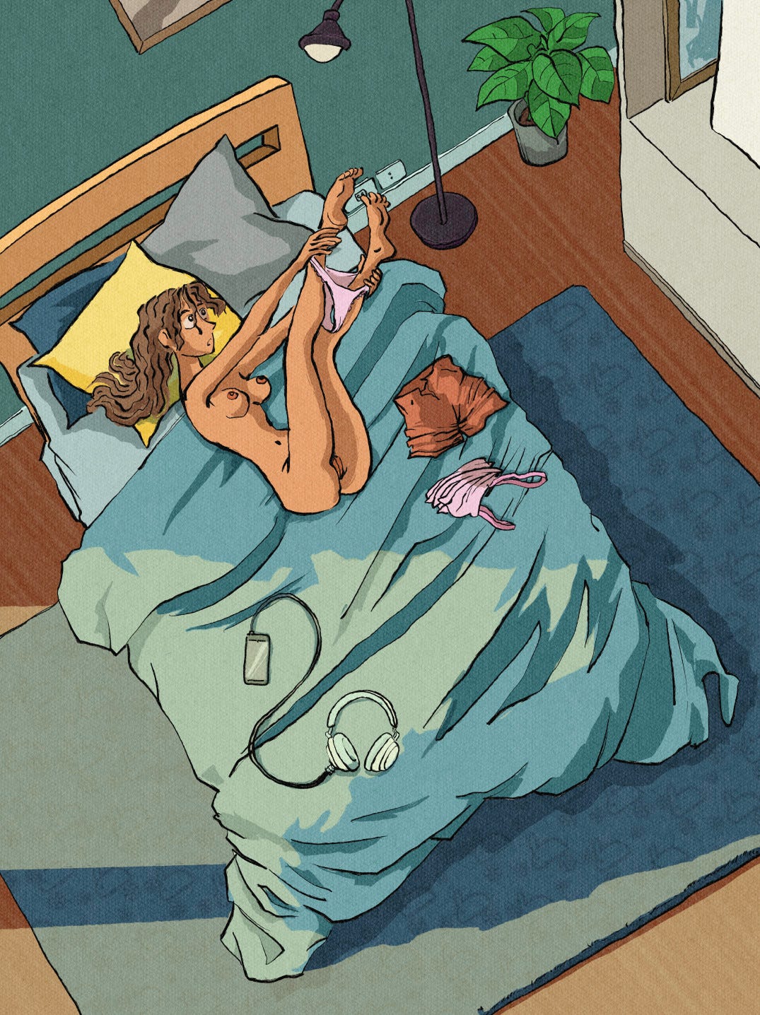 A top-down view showing the woman actively removing her shorts and underwear. She is lifting her hips and shifting her body on the rumpled white duvet to slide the dark fabric down her bare legs. Her movements appear natural and relaxed, capturing a clumsy yet intimate moment of undressing.