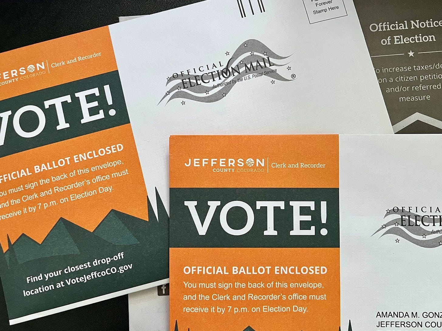 Colorado ballot envelopes and a voter guide (Credit: Mike LaSusa) Colorado ballot envelopes and a voter guide (Credit: Mike LaSusa)