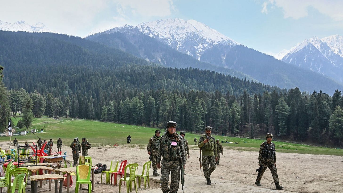 Indian security officers inspect the site in Pahalgam where militants opened fire on tourists in Pahalgam in Indian-controlled Kashmir, on Wednesday, April 23, 2025. Indian security officers inspect the site in Pahalgam where militants opened fire on tourists in Pahalgam in Indian-controlled Kashmir, on Wednesday, April 23, 2025.