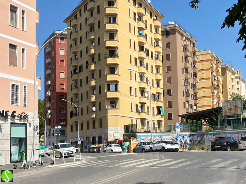 Steve Butcher photo of painted apartment buildings in Rome 2025