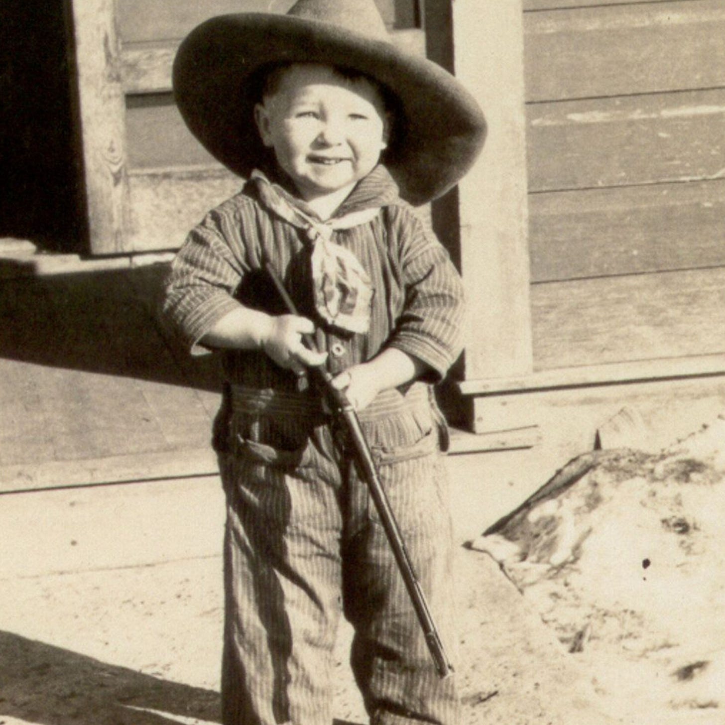 photo of a small child with toy gun