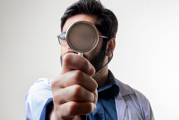 man in blue dress shirt wearing black framed eyeglasses man in blue dress shirt wearing black framed eyeglasses
