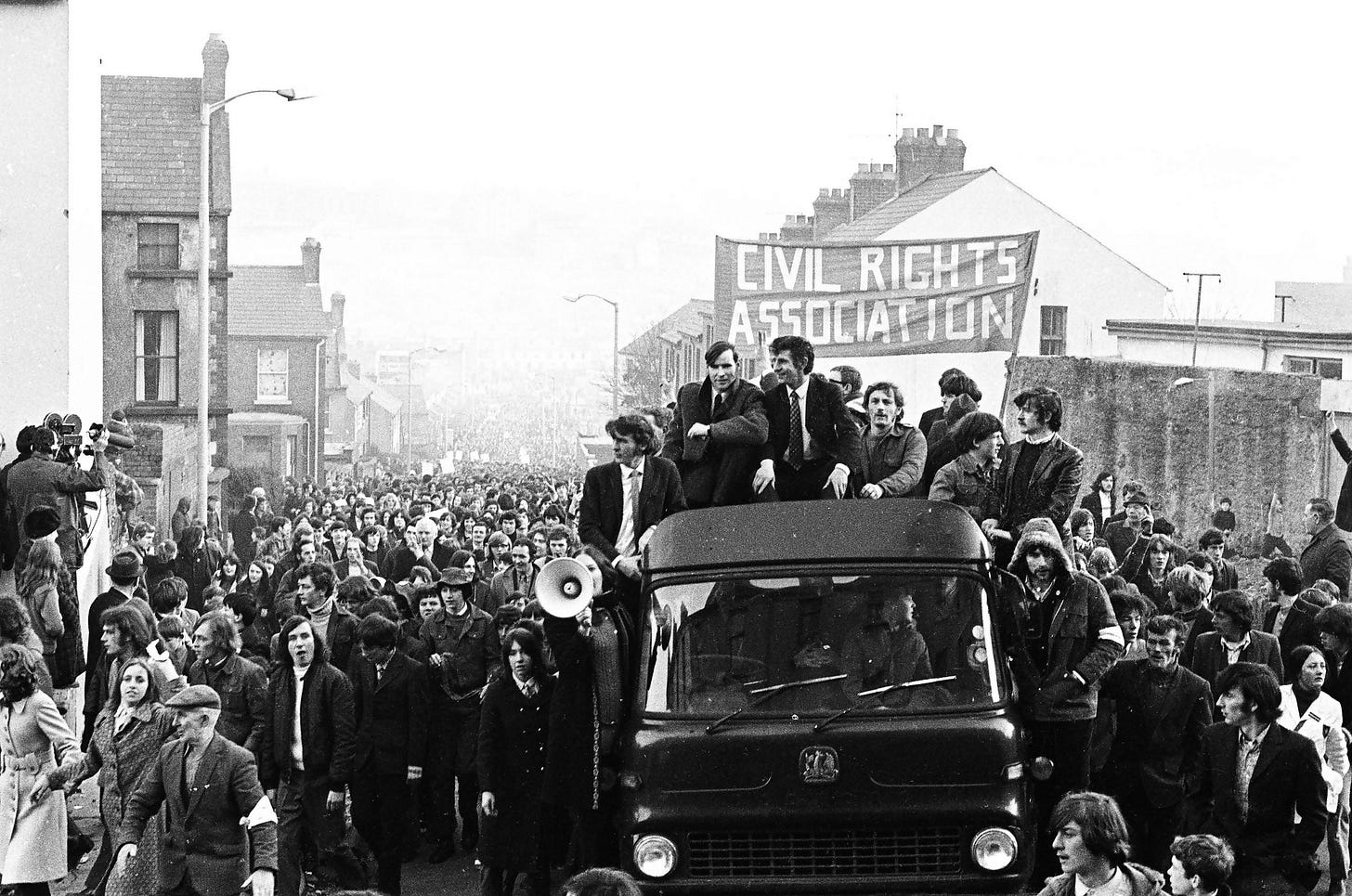 Bloody Sunday, marchers walking down a street in Derry, Northern Ireland