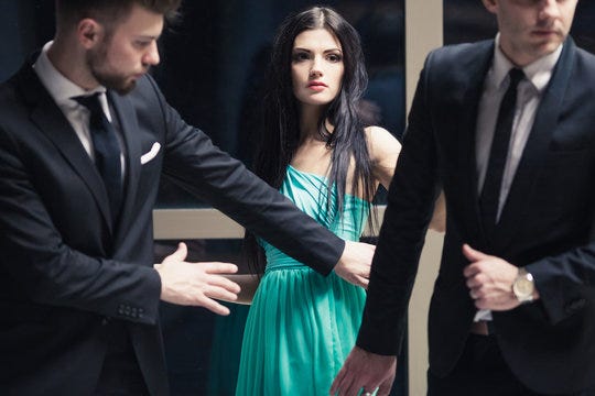 Beautiful female celebrity with bodyguards Stock Photo | Adobe Stock