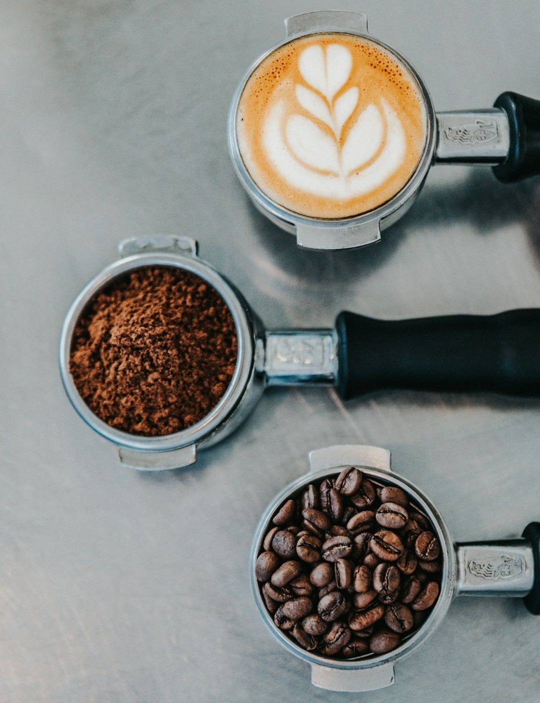 flat lay photography of coffee latte, ground coffee, and coffee beans flat lay photography of coffee latte, ground coffee, and coffee beans