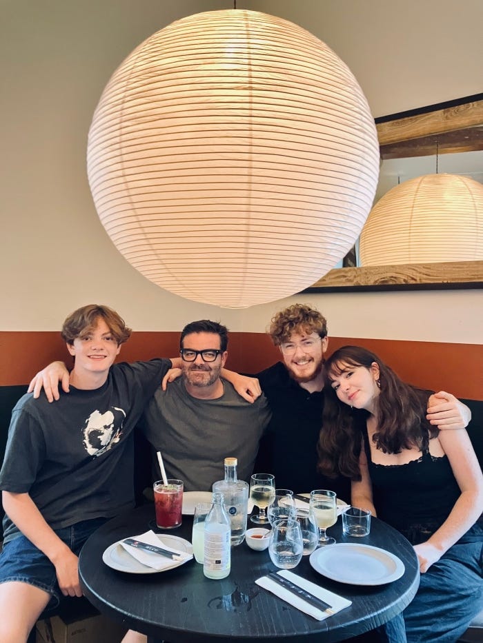 Brandon Webb and his children at dinner in Lisbon, Portugal.